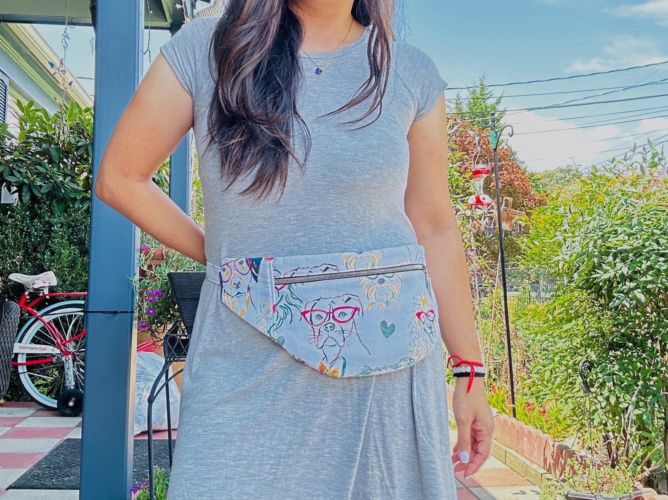 Lady wearing dog walking fabric fanny pack with dog and glasses